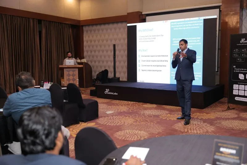 Shankar Morwal presenting on stage at a HabileLabs × AWS C-Suite event
